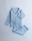 Light blue pajama set on a light gray background
