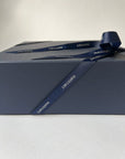 Blue gift box with a blue ribbon on a light gray background
