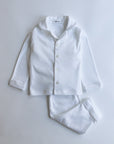 White pajama set on a light gray background